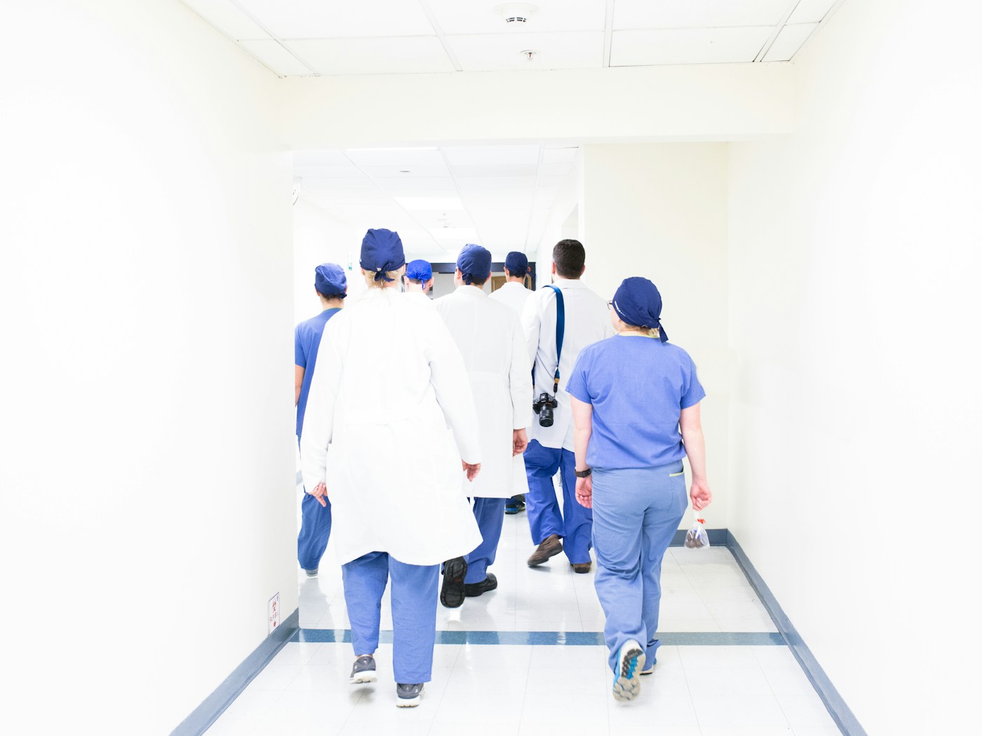 A professional clinical team walking through a modern practice